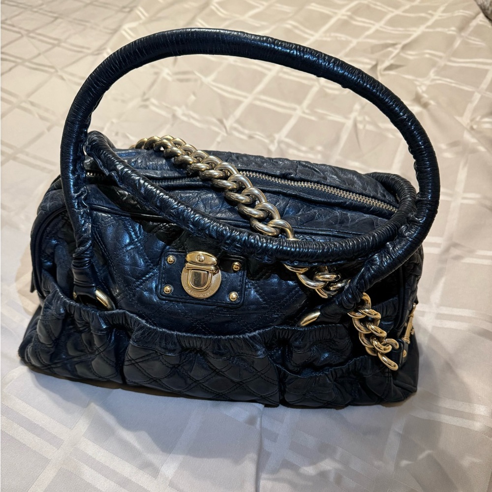 Shoulder bag with gold chain handle and leather handle. With no rips.